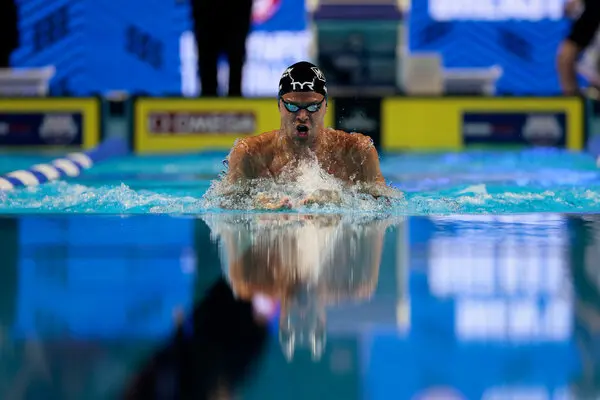 Which stroke is Michael Phelps known for dominating?
