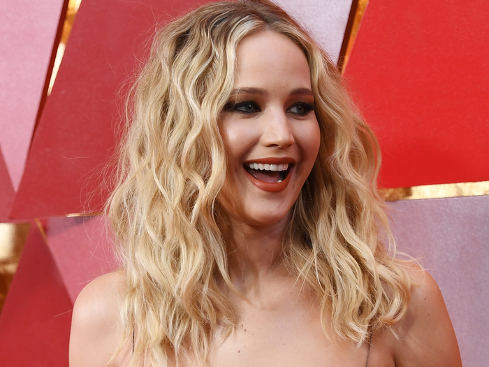 Which David O. Russell film did Jennifer Lawrence star in alongside Christian Bale and Bradley Cooper?