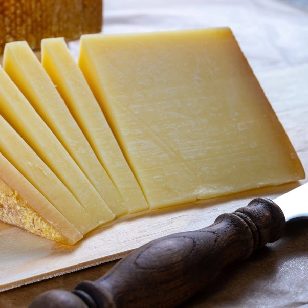 Which cheese is commonly used in Swiss dishes like raclette?