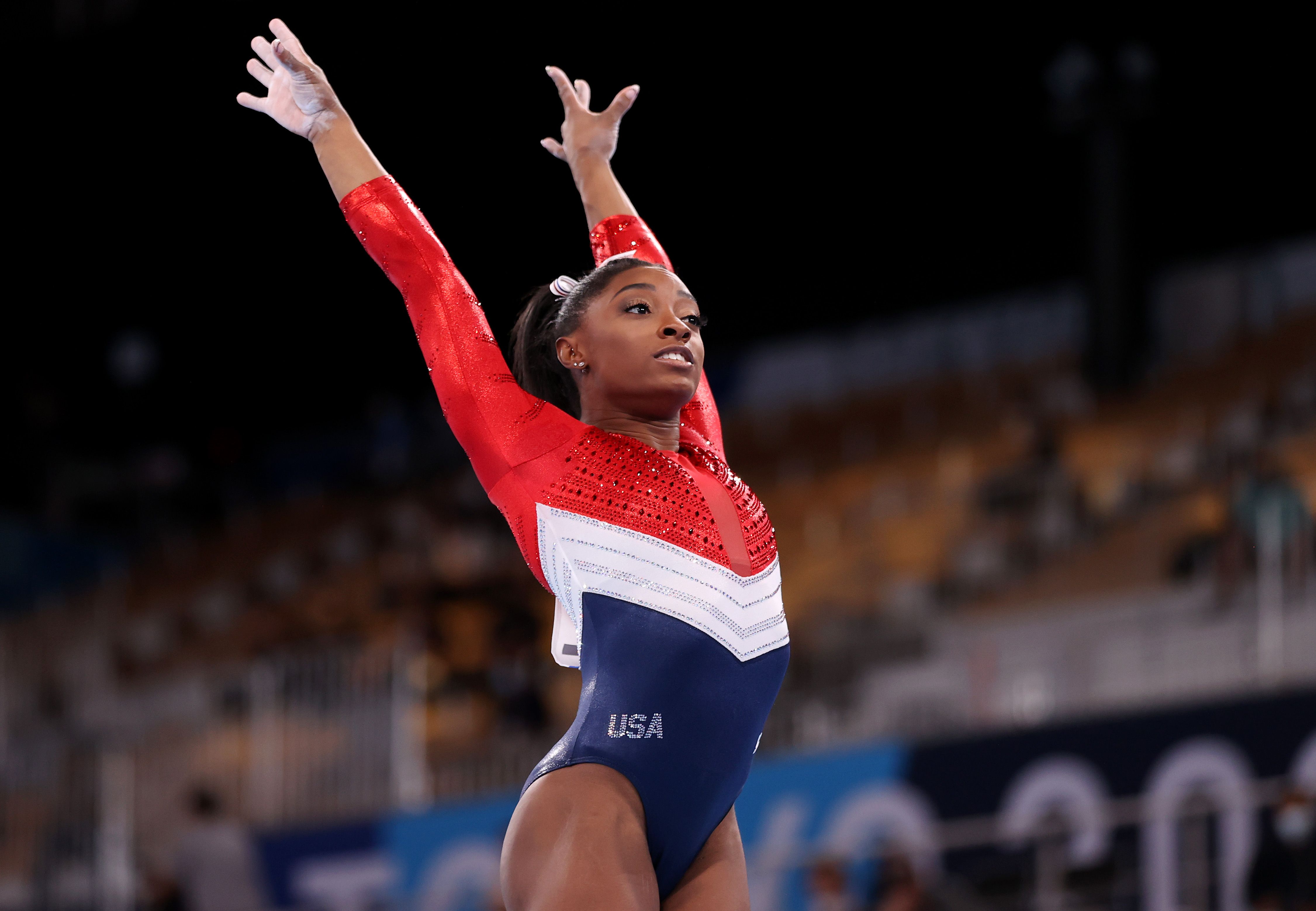 Who is Simone Biles' coach and mentor?