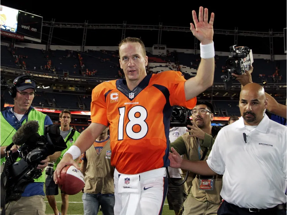 Which college football award did Peyton Manning win in 1997?