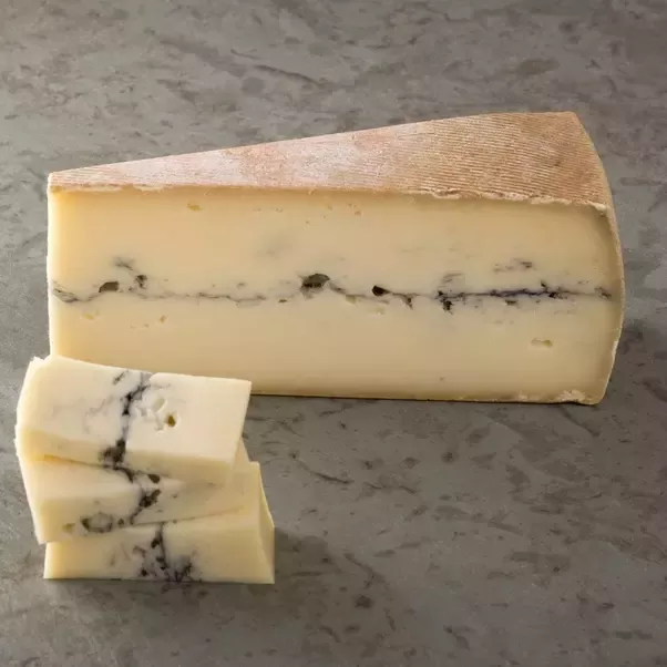 Which cheese is known for its semi-hard texture and fruity taste?