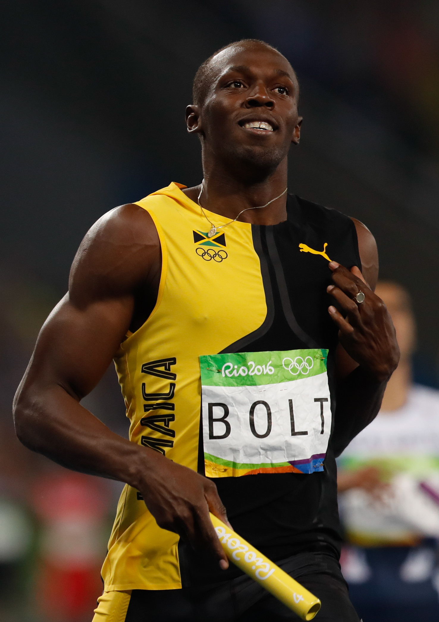 Who presented Usain Bolt with his first Olympic gold medal?