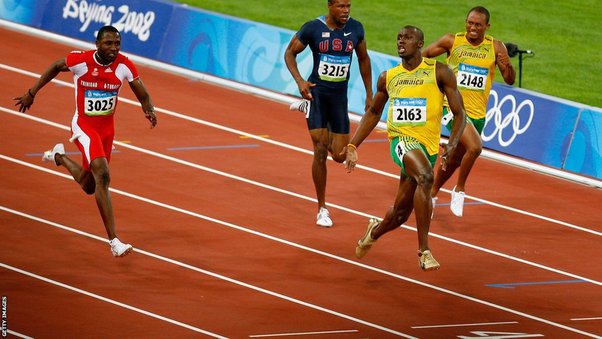 Which Jamaican athlete held the 100-meter world record before Usain Bolt?