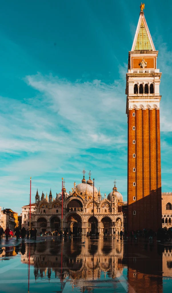 Which Venetian palace is known for its impressive collection of art, including works by Titian and Tintoretto?
