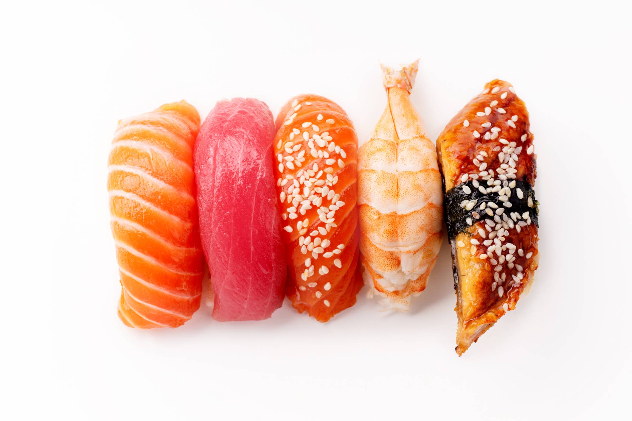 What is the purpose of dipping the fish side of nigiri sushi into soy sauce?