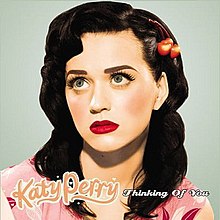 Which song became Katy Perry's first number-one hit on the Billboard Hot 100?
