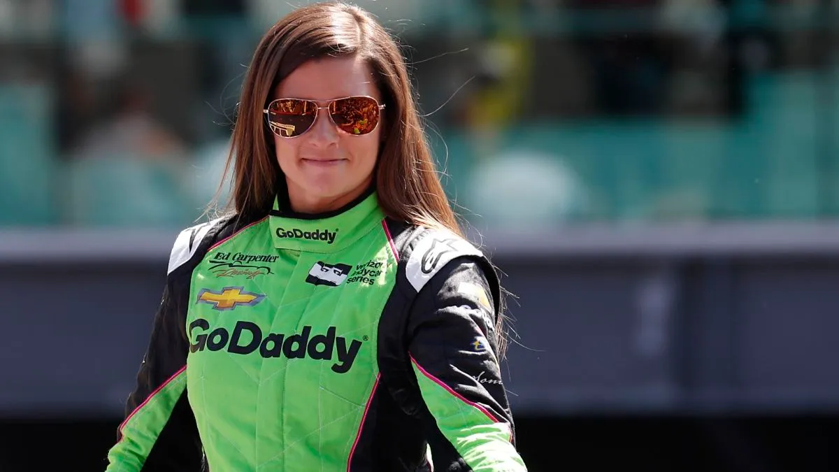 Which racing category did Danica Patrick compete in after retiring from professional racing?