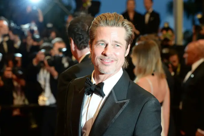Which Brad Pitt film features his iconic line 'What's in the box?'