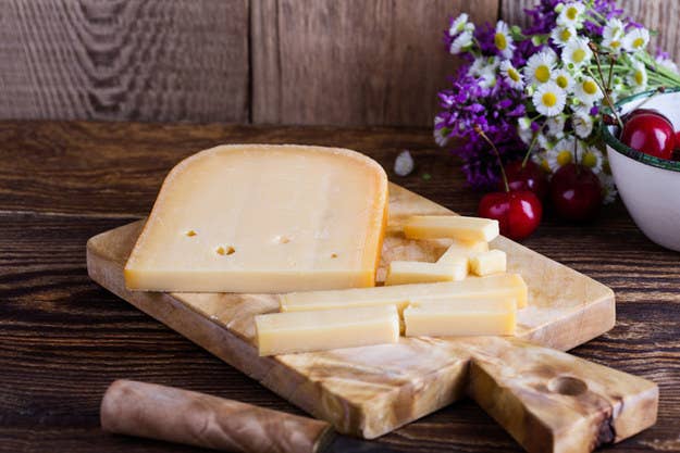 Which cheese is known for its strong and tangy flavor?