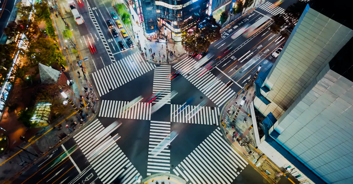 What is the name of the famous upscale shopping street in Tokyo known for its luxury brands?