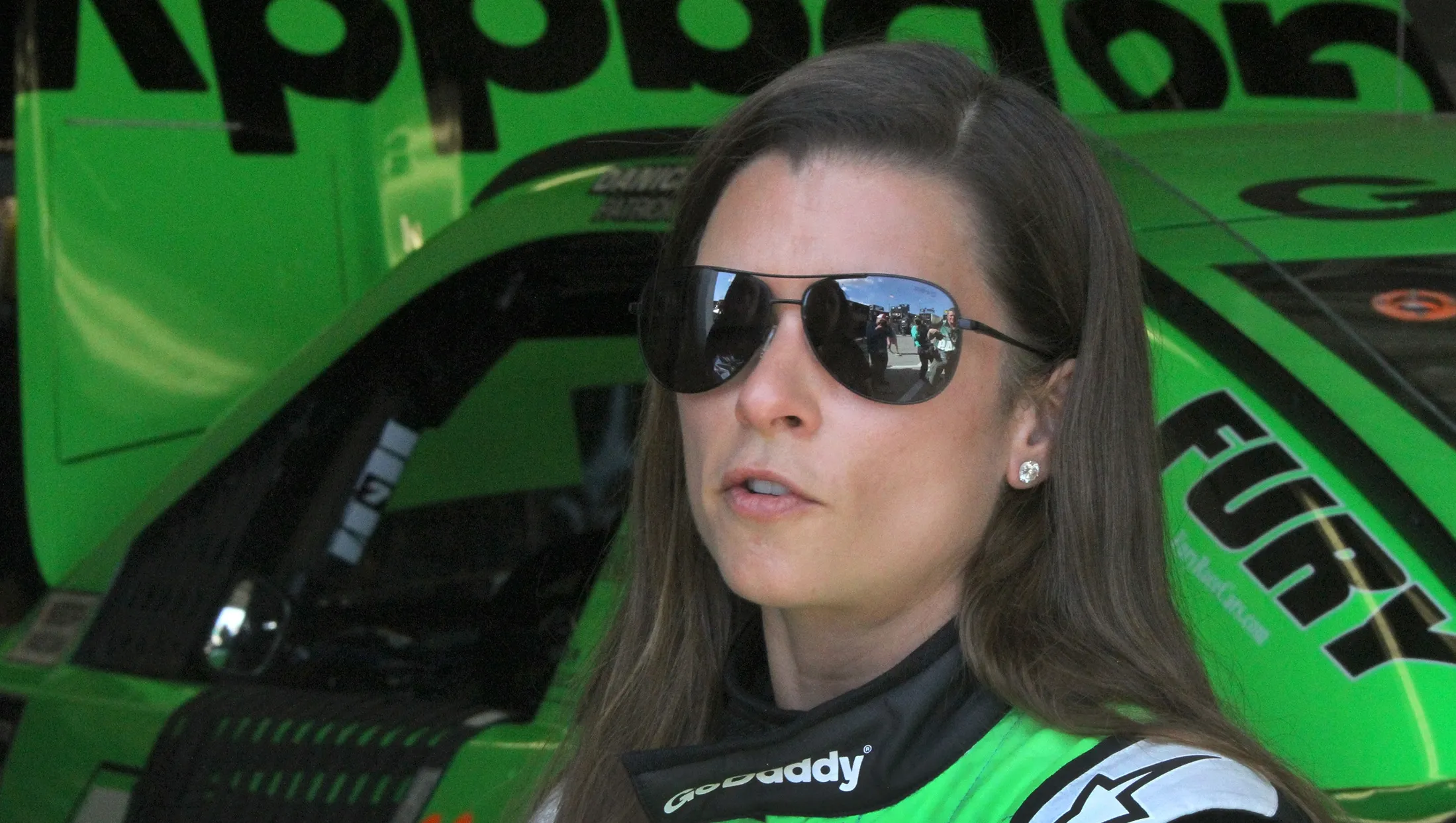 Which race track did Danica Patrick win her first pole position in the NASCAR Cup Series?