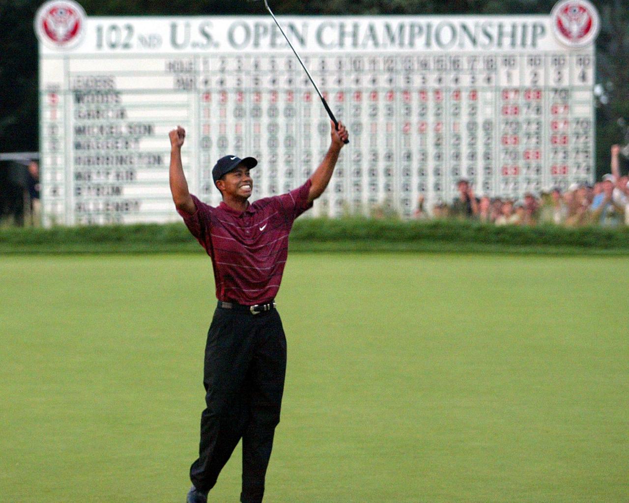 Which major championship did Tiger Woods win in his first full season as a professional?
