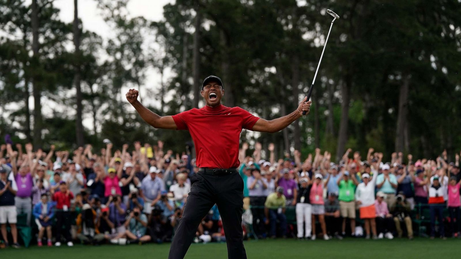In which year did Tiger Woods win his first major championship?