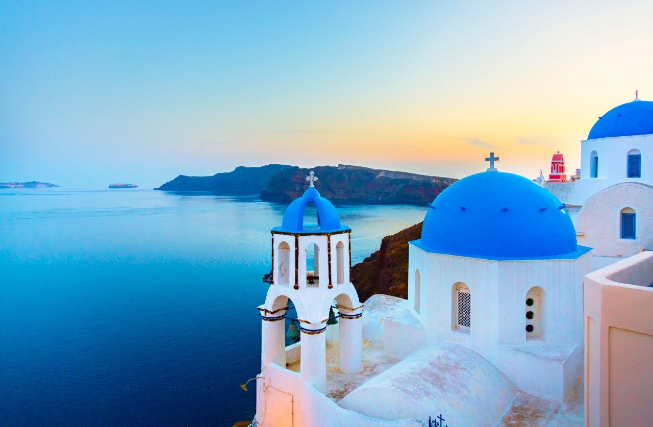 What is the famous Santorini dessert made of fried dough balls soaked in honey syrup?