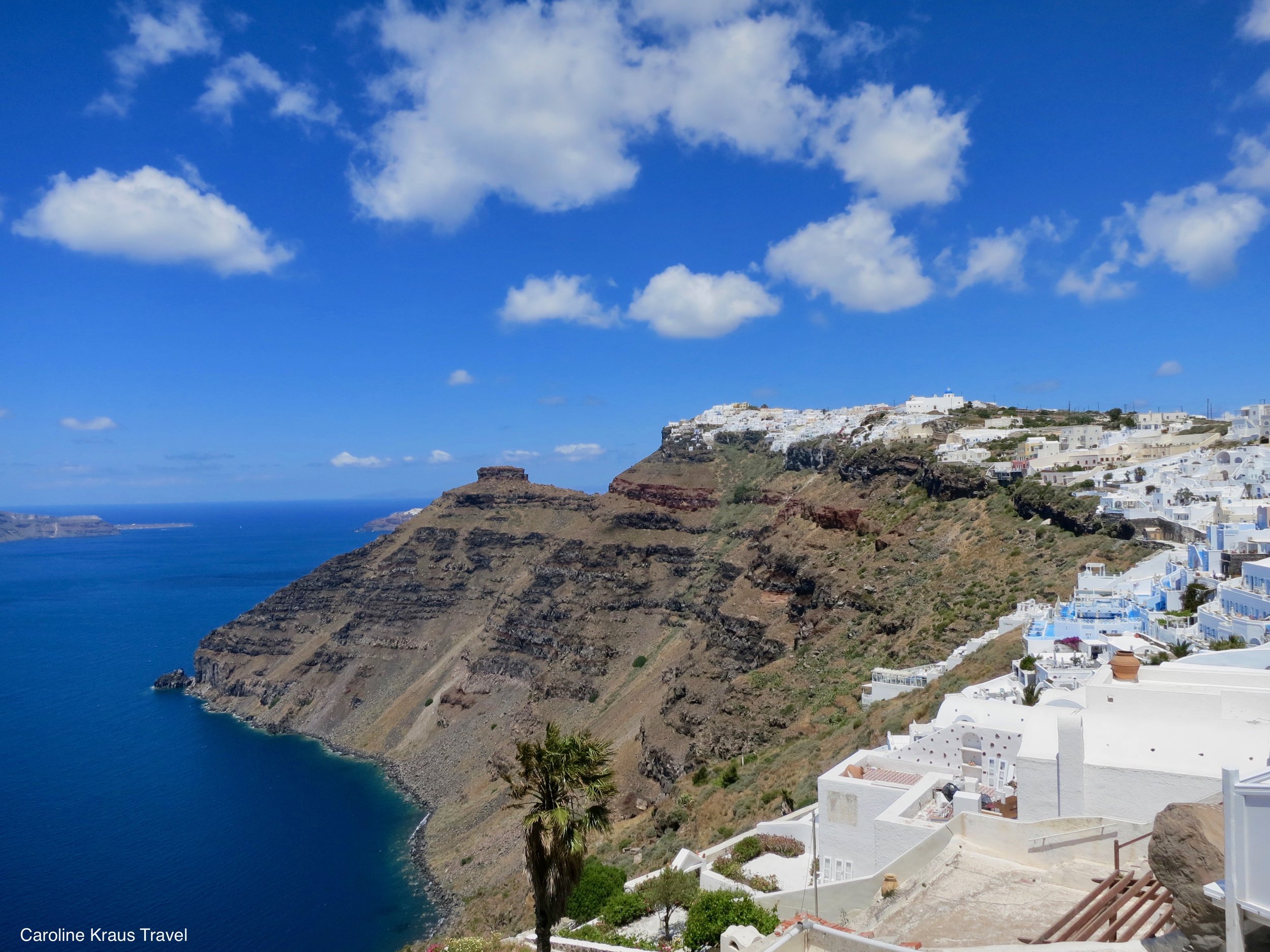 Which famous Santorini activity involves watching the sunset from the village of Oia?
