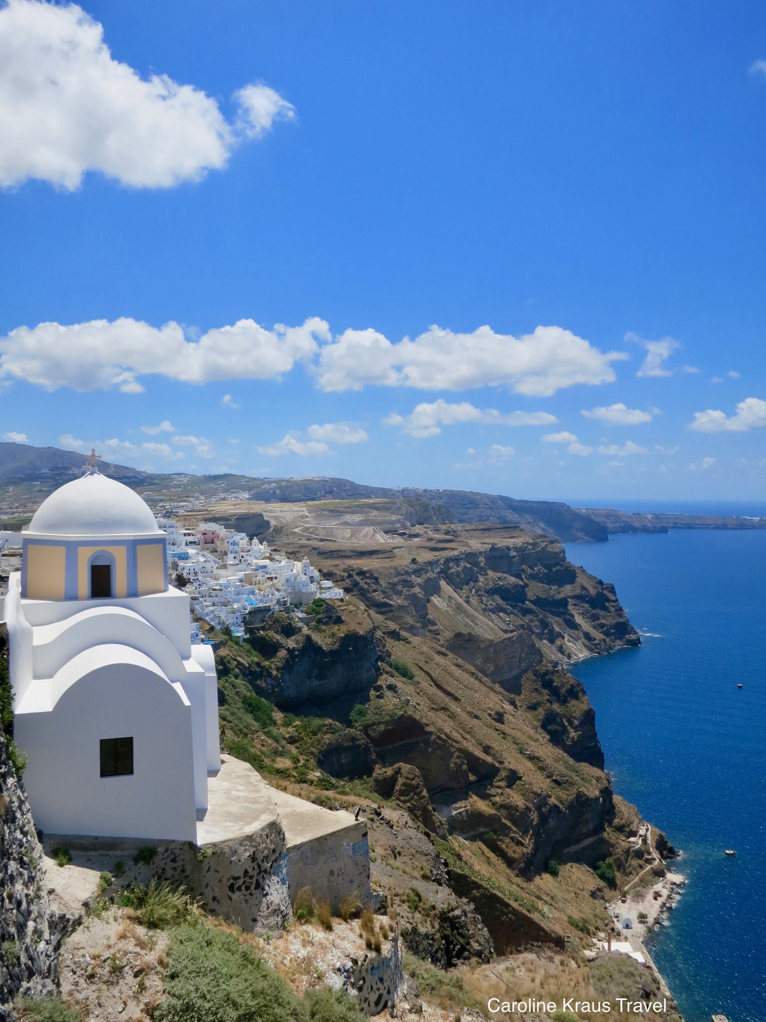 Which famous blue-domed church is a symbol of Santorini?