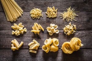 Which pasta shape is short, tube-like, and cut diagonally?